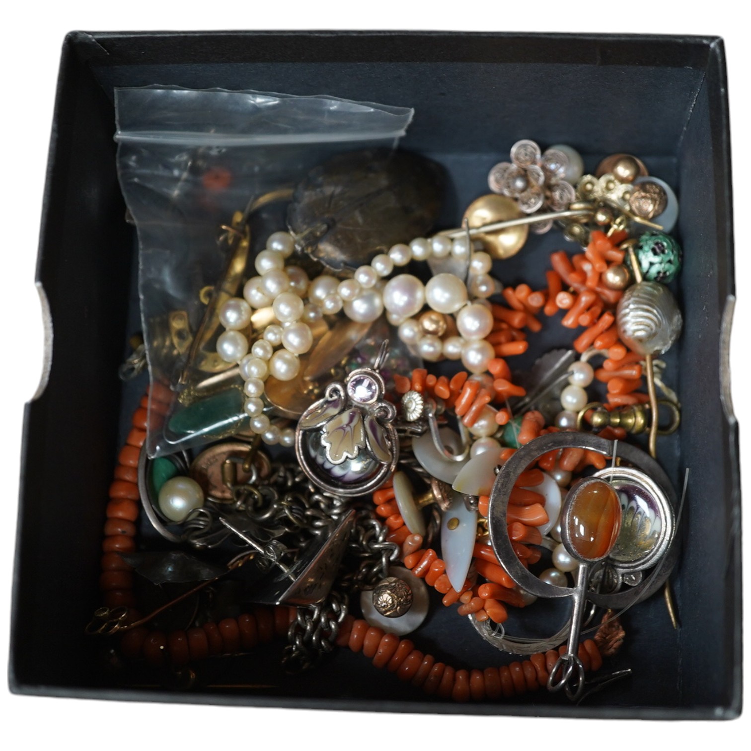 A quantity of assorted mainly costume jewellery including tortoiseshell and pique pendant, coral necklace, cultured pearl necklace, etc. Condition - poor to fair